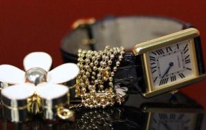The black leather strap copy Cartier Tank watch has silver-plated dial.