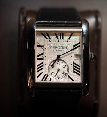 The blue hands and black Roman numerals hour markers are the iconic features of Cartier.