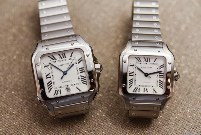 The blue hands and black hour markers are contrasted to the silver dials.